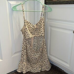 SHEIN light tan romper with midsection cutout and ruffle bottom.